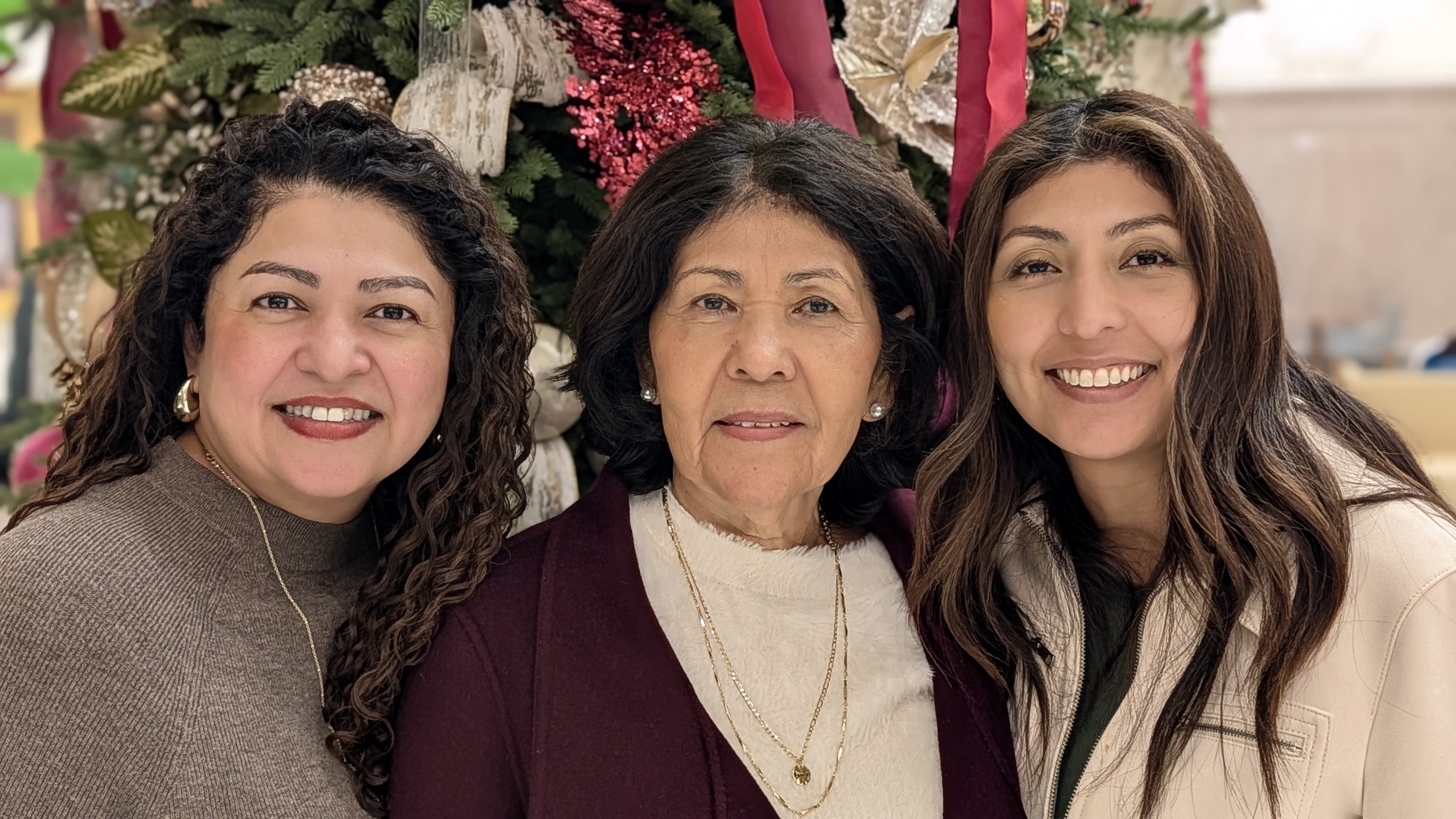 Aura with her mother and sister at Christmastime